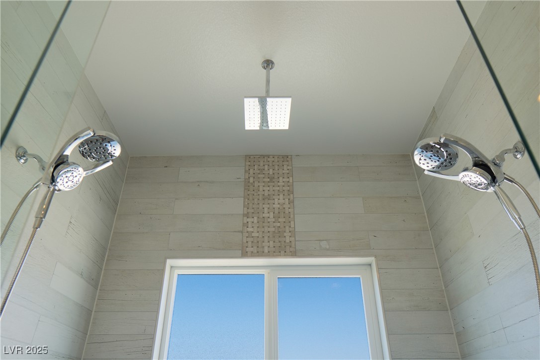 5400 Grain Mill Road Pahrump, NV 89061 - Photo 31 of 67 Bathroom view of tiled shower and wooden walls