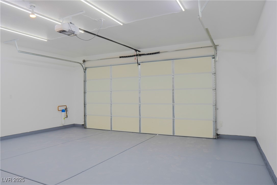 5400 Grain Mill Road Pahrump, NV 89061 - Photo 49 of 67 Garage featuring baseboards and a garage door opener