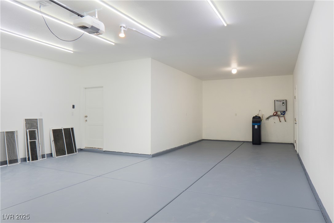 5400 Grain Mill Road Pahrump, NV 89061 - Photo 50 of 67 Garage with a garage door opener and baseboards