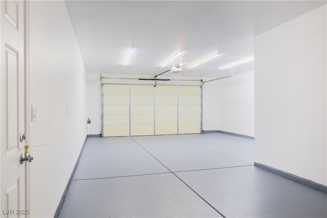 5400 Grain Mill Road Pahrump, NV 89061 - Photo 53 of 67 Garage featuring a garage door opener and baseboards