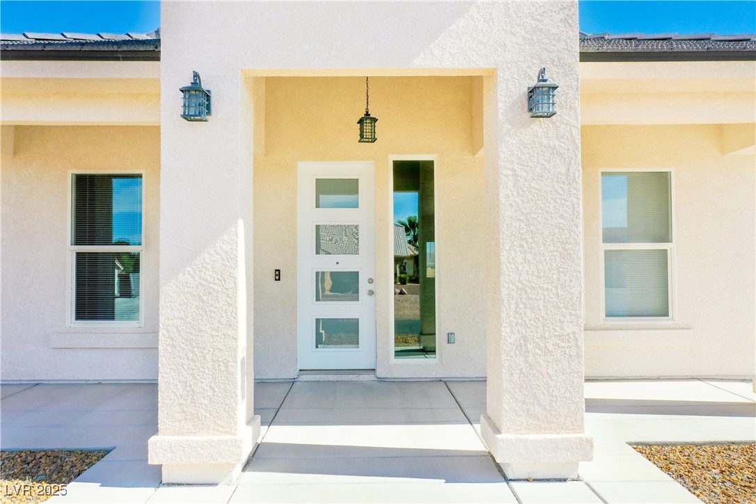 5400 Grain Mill Road Pahrump, NV 89061 - Photo 56 of 67 View of exterior entry featuring stucco siding