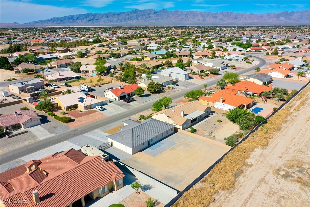 5400 Grain Mill Road Pahrump, NV 89061 - Photo 59 of 67 Aerial perspective of suburban area featuring a mountainous background