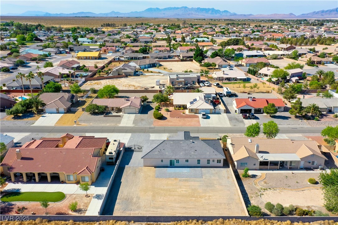 5400 Grain Mill Road Pahrump, NV 89061 - Photo 60 of 67 Aerial view of residential area featuring a mountainous background
