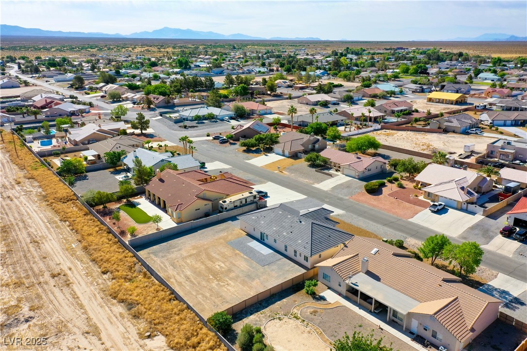 5400 Grain Mill Road Pahrump, NV 89061 - Photo 61 of 67 Aerial view of residential area with mountains