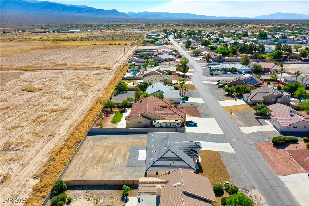 5400 Grain Mill Road Pahrump, NV 89061 - Photo 62 of 67 Aerial perspective of suburban area featuring a mountain backdrop