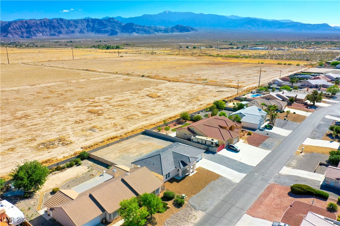 5400 Grain Mill Road Pahrump, NV 89061 - Photo 63 of 67 View of rural area featuring a mountain backdrop and nearby suburban area