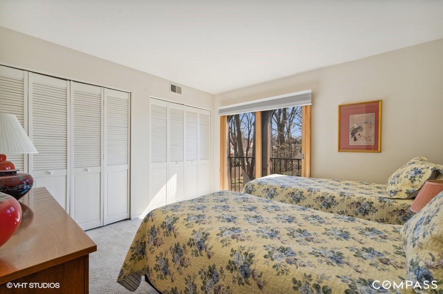 1119 Deerfield Road Deerfield, IL 60015 - Photo 11 of 19 a bedroom with a bed and a window