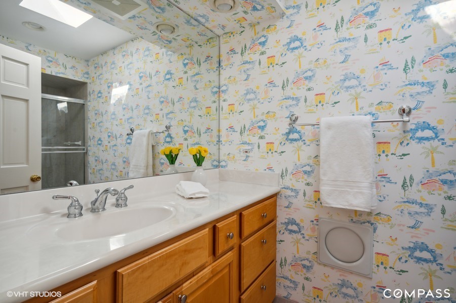 1119 Deerfield Road Deerfield, IL 60015 - Photo 13 of 19 a bathroom with a granite countertop sink and a mirror