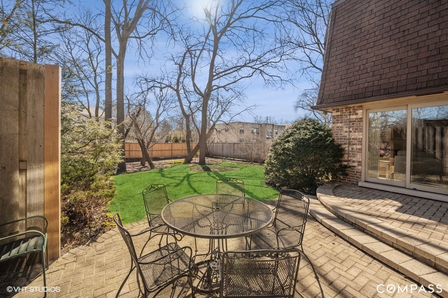 1119 Deerfield Road Deerfield, IL 60015 - Photo 14 of 19 a view of a chair and table in backyard