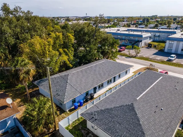 a view of a terrace with a table and chairs