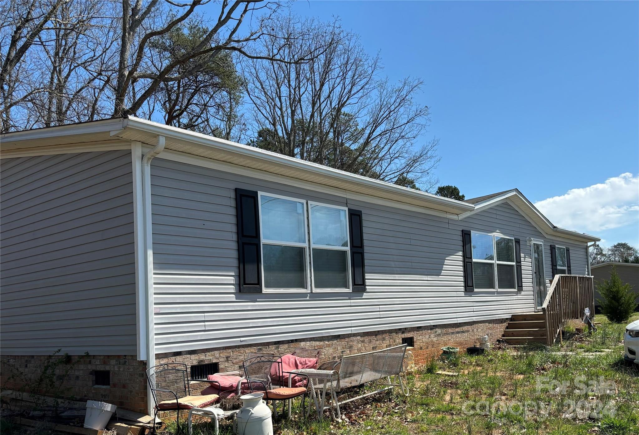 a backyard of a house with seating space