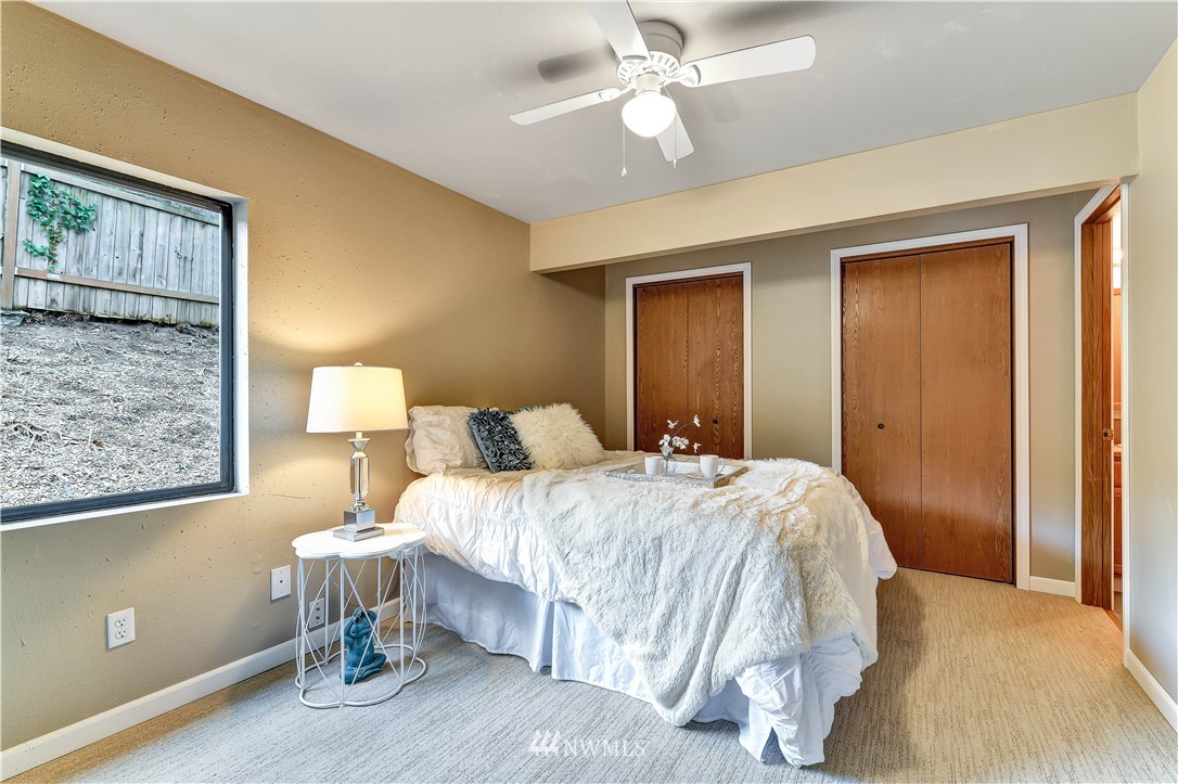 5529 Lowell Road Everett, WA 98203 - Photo 12 of 22 a bedroom with a bed and a lamp