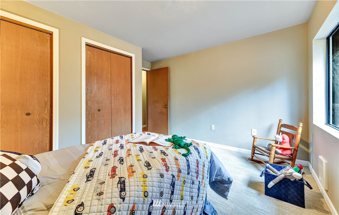 5529 Lowell Road Everett, WA 98203 - Photo 17 of 22 a bedroom with a bed and a window