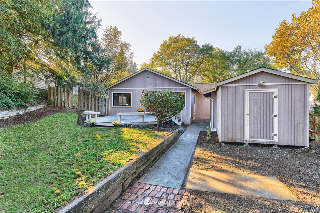 5529 Lowell Road Everett, WA 98203 - Photo 21 of 22 a view of house with backyard and swimming pool