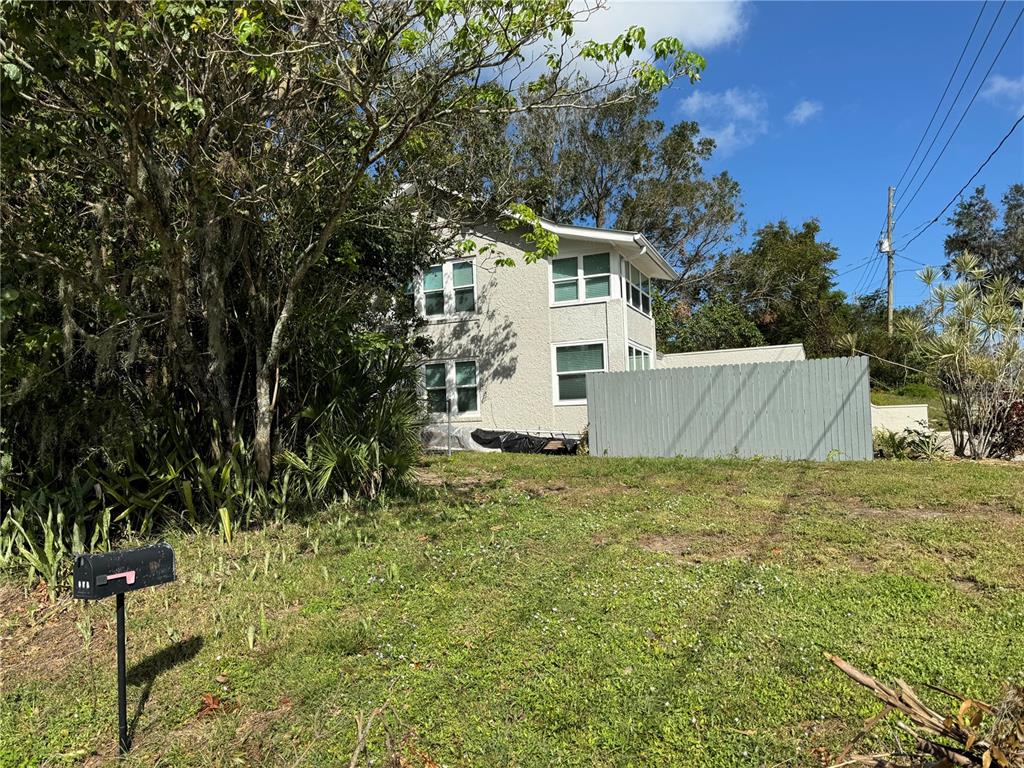 302 West Wall Street Frostproof, FL 33843 - Photo 14 of 37 a view of a outdoor space and a yard