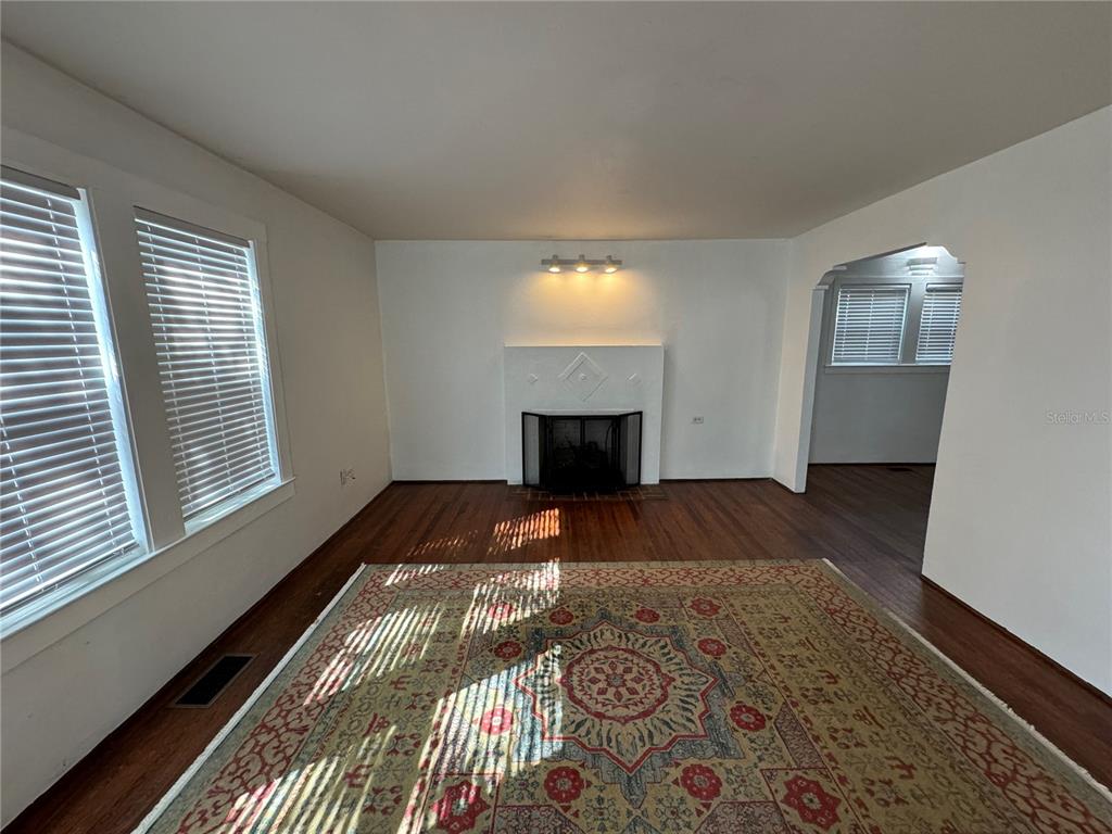 302 West Wall Street Frostproof, FL 33843 - Photo 23 of 37 a bedroom with a bed and a window