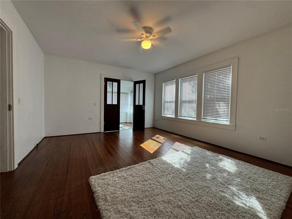 302 West Wall Street Frostproof, FL 33843 - Photo 29 of 37 a view of an empty room with window and wooden floor