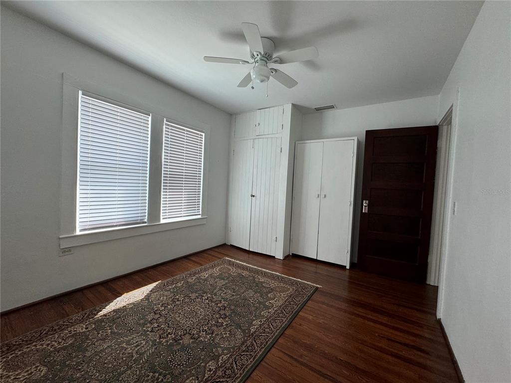 302 West Wall Street Frostproof, FL 33843 - Photo 35 of 37 a view of an empty room with wooden floor and a window