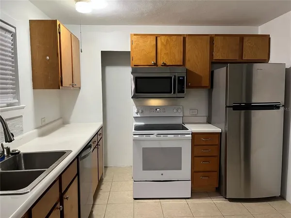 a kitchen with a stove microwave and refrigerator