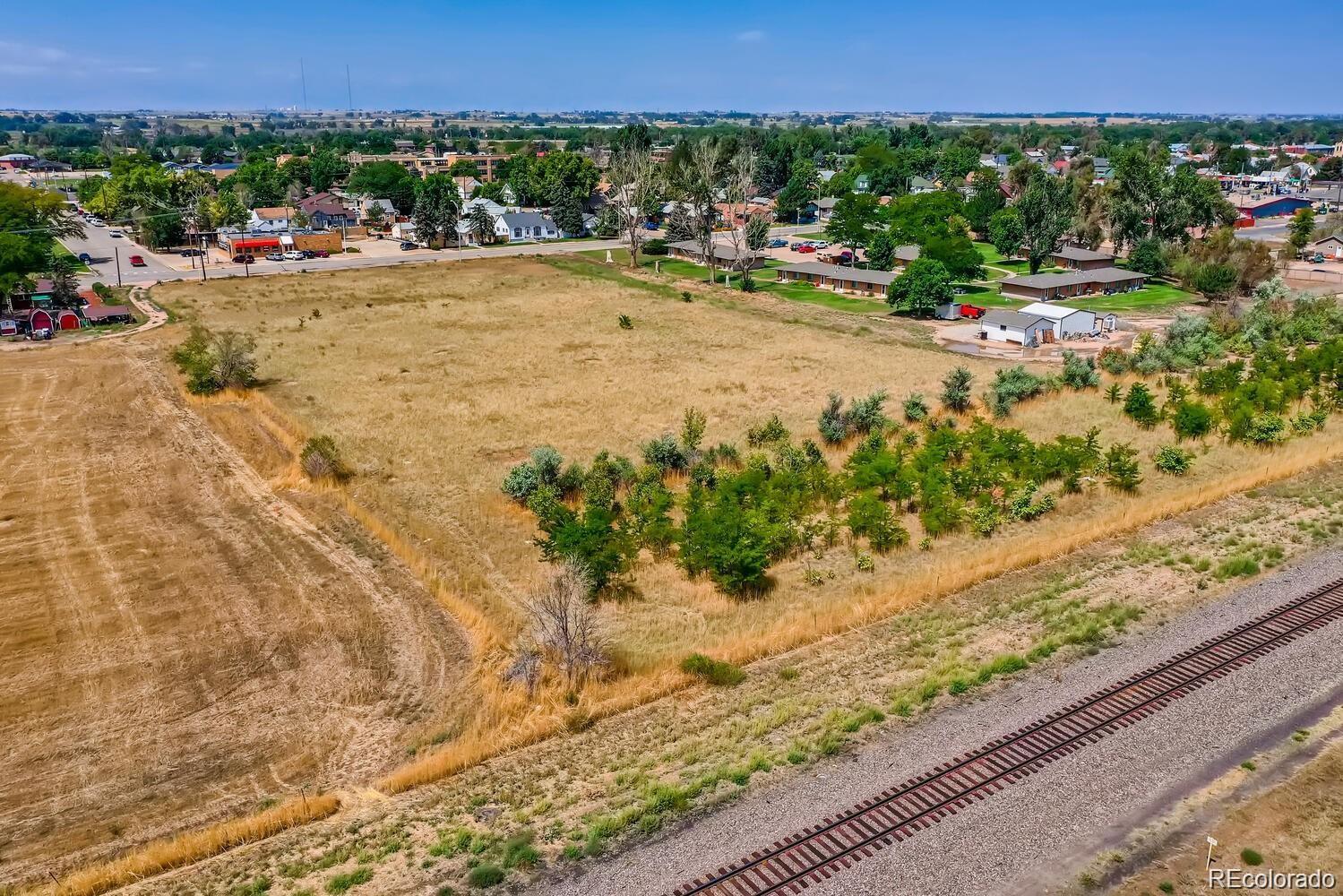 South Denver Avenue Fort Lupton, CO 80621 - Photo 9 of 11 a view of swimming pool with a yard