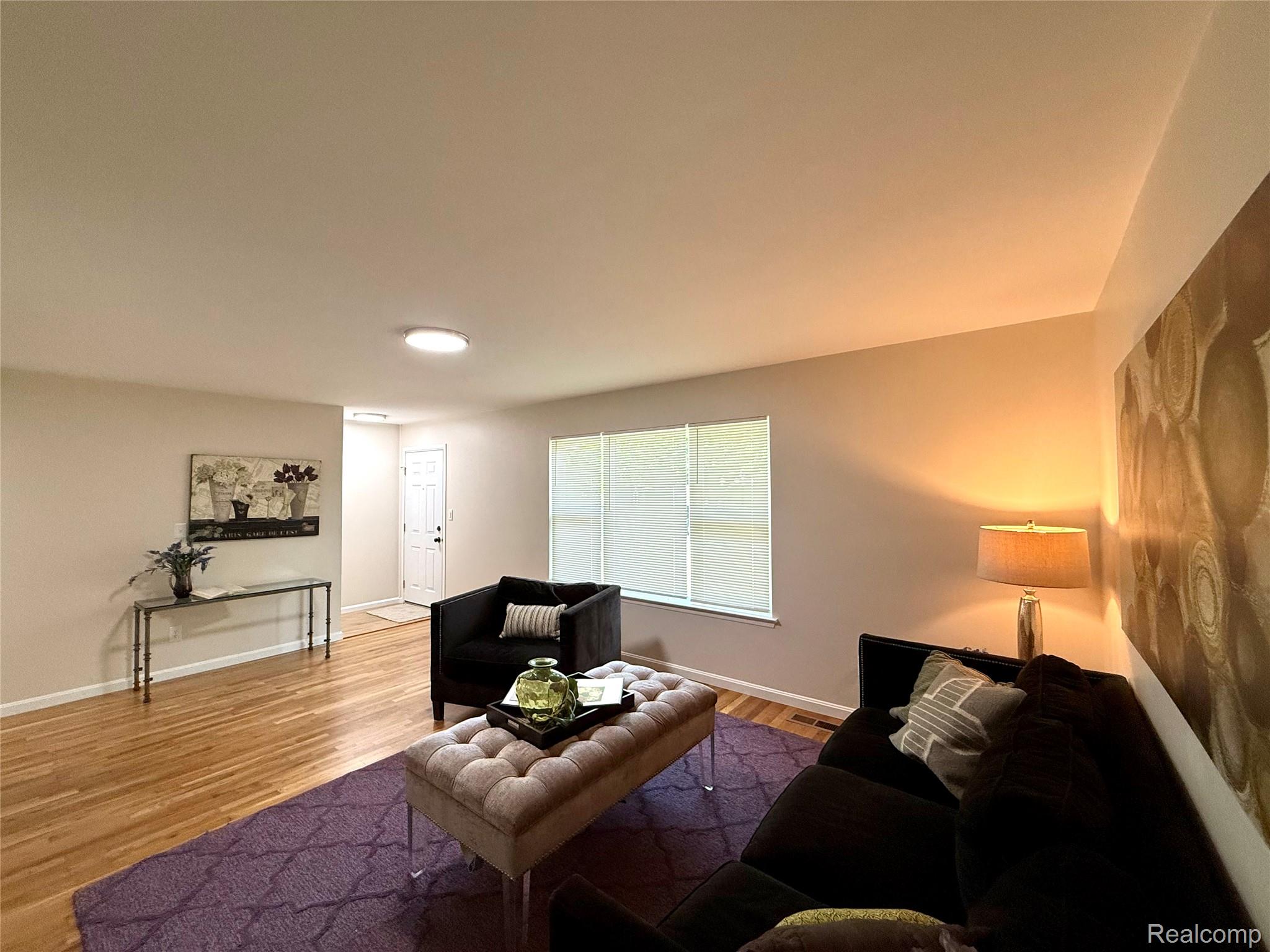 39909 Lynn Street Canton, MI 48187 - Photo 3 of 45 Bright living area featuring wood-finish flooring, neutral wall tones, and recessed lighting