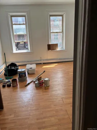 a room with gym equipment and a window