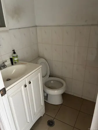 a bathroom with a toilet and a sink