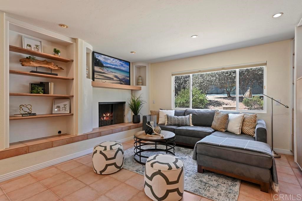 546 Rancho Santa Fe Road Encinitas, CA 92024 - Photo 14 of 48 a living room with furniture and a fireplace