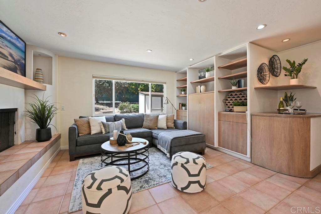 546 Rancho Santa Fe Road Encinitas, CA 92024 - Photo 15 of 48 a living room with furniture a rug and a window