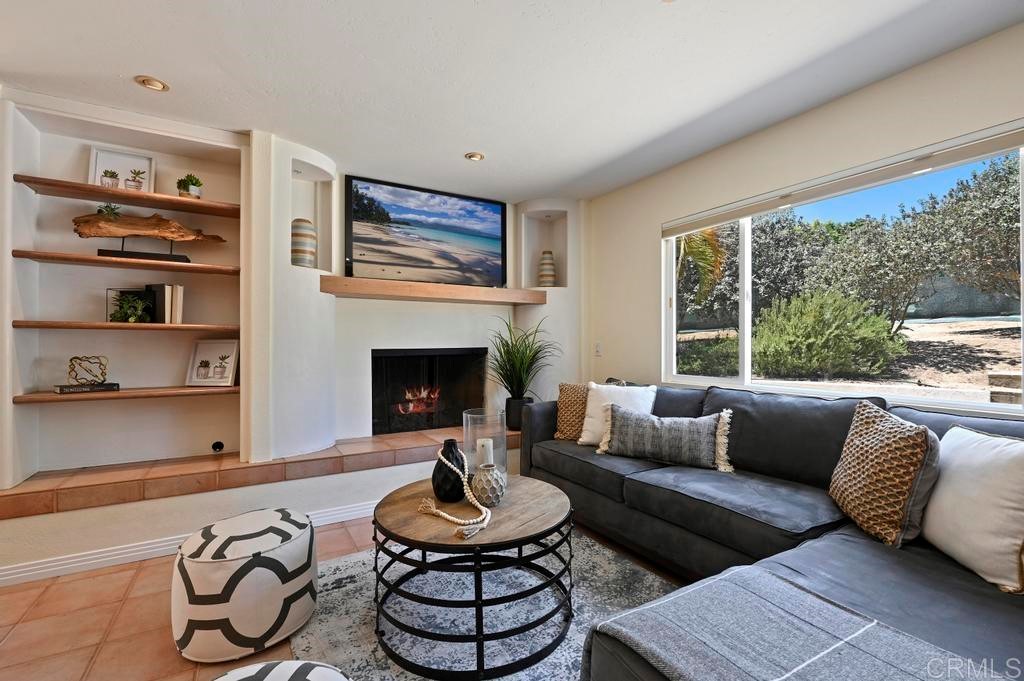 546 Rancho Santa Fe Road Encinitas, CA 92024 - Photo 16 of 48 a living room with furniture a rug and a large window