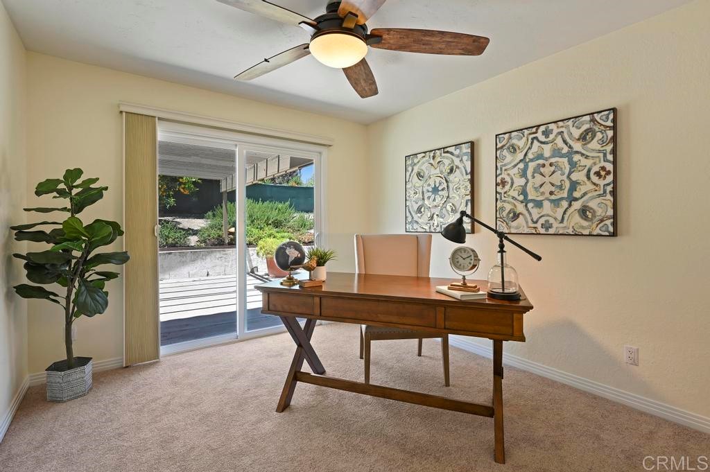 546 Rancho Santa Fe Road Encinitas, CA 92024 - Photo 17 of 48 a view of a workspace with furniture and a potted plant