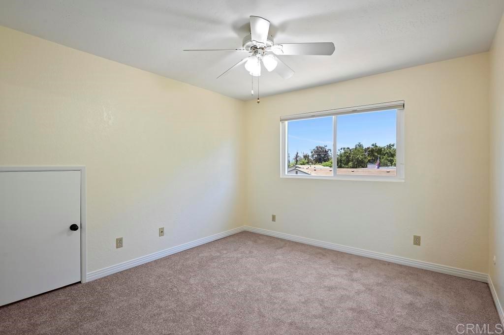 546 Rancho Santa Fe Road Encinitas, CA 92024 - Photo 22 of 48 a view of an empty room with a fan