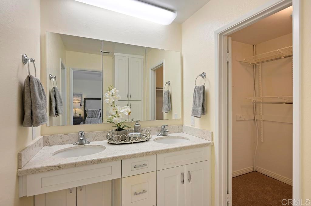 546 Rancho Santa Fe Road Encinitas, CA 92024 - Photo 28 of 48 a bathroom with double sink and a mirror
