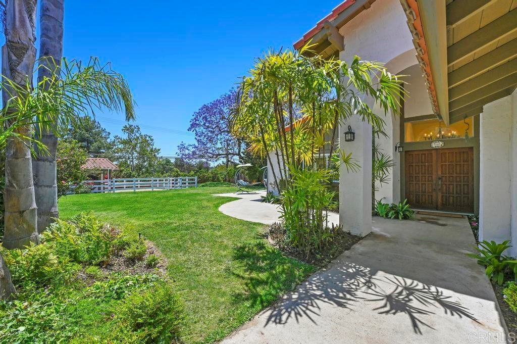 546 Rancho Santa Fe Road Encinitas, CA 92024 - Photo 3 of 48 a view of a garden with a building