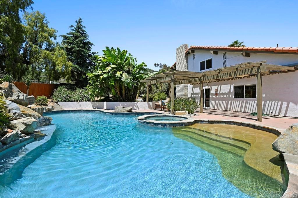 546 Rancho Santa Fe Road Encinitas, CA 92024 - Photo 31 of 48 a view of a house with swimming pool and sitting area