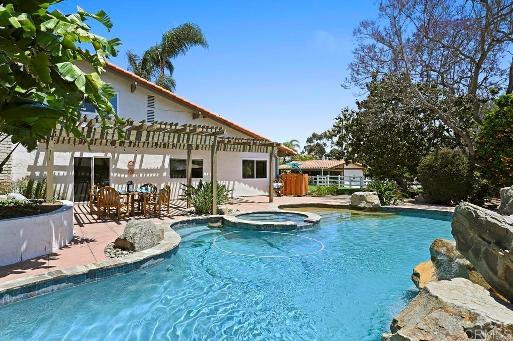 546 Rancho Santa Fe Road Encinitas, CA 92024 - Photo 33 of 48 a view of a house with backyard sitting area and garden