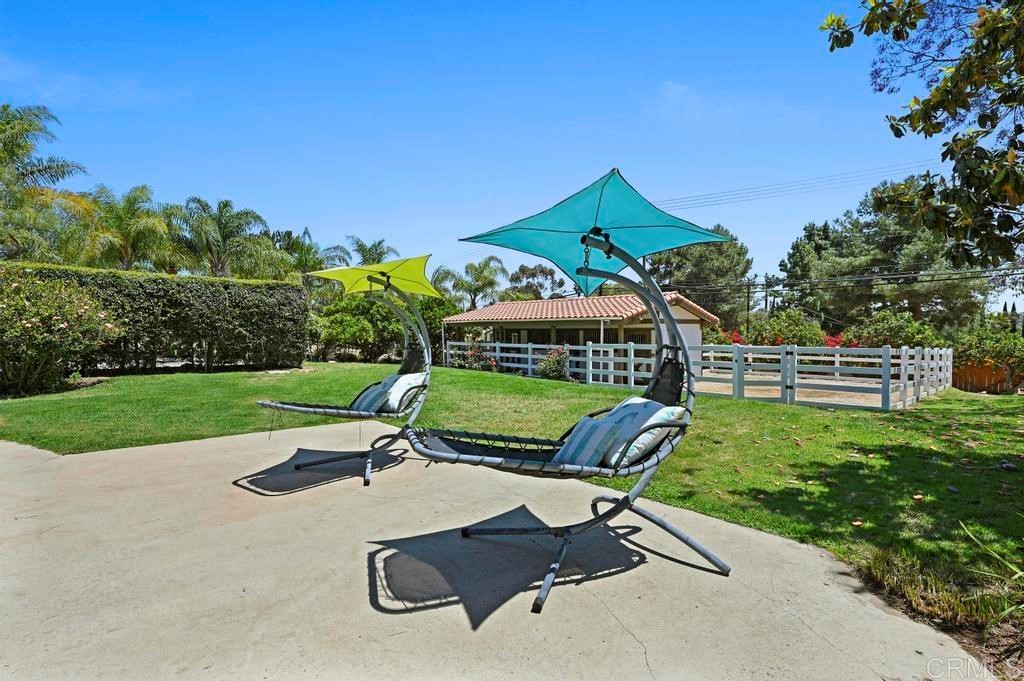 546 Rancho Santa Fe Road Encinitas, CA 92024 - Photo 36 of 48 a park view with a bench in a garden