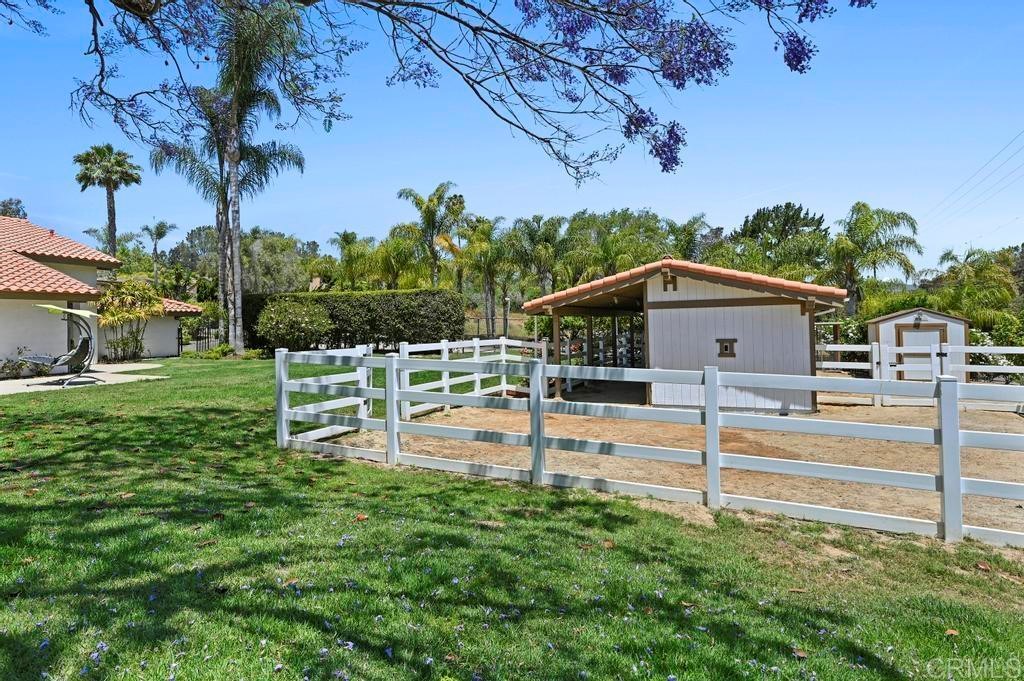 546 Rancho Santa Fe Road Encinitas, CA 92024 - Photo 38 of 48 a view of a house with backyard and a tree