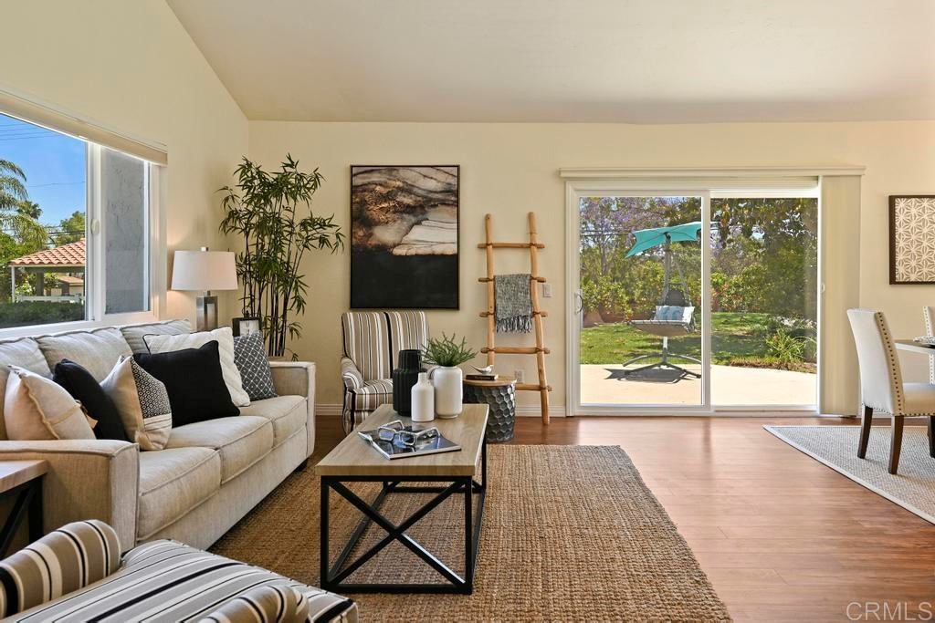 546 Rancho Santa Fe Road Encinitas, CA 92024 - Photo 5 of 48 a living room with furniture and a floor to ceiling window