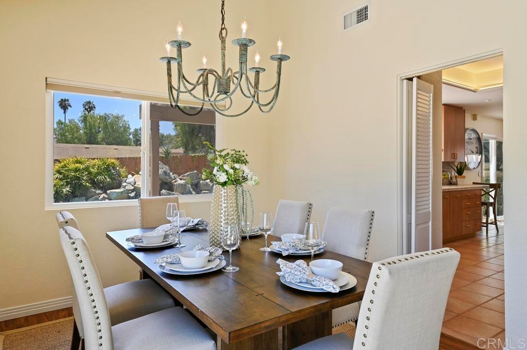 546 Rancho Santa Fe Road Encinitas, CA 92024 - Photo 8 of 48 a view of a dining room with furniture window and wooden floor