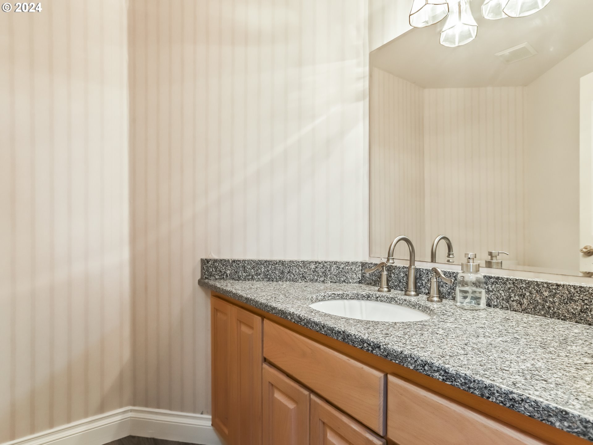 2710 Northeast 240th Street Ridgefield, WA 98642 - Photo 24 of 48 a bathroom with a granite countertop sink and a mirror