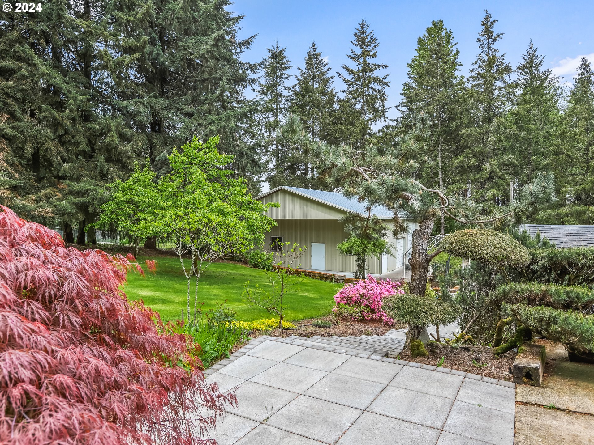 2710 Northeast 240th Street Ridgefield, WA 98642 - Photo 44 of 48 a front view of a house with garden