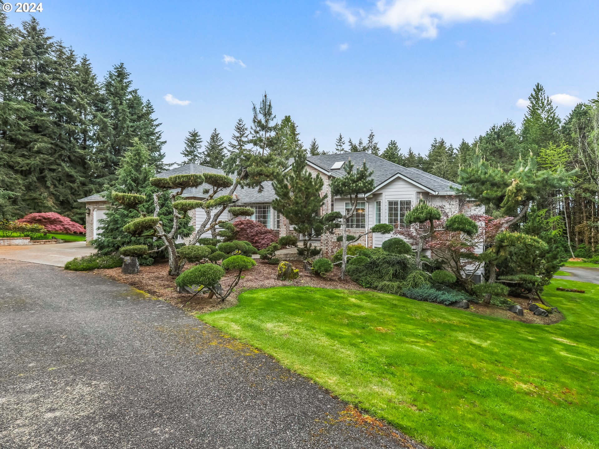 2710 Northeast 240th Street Ridgefield, WA 98642 - Photo 5 of 48 a view of a house with a yard and potted plants