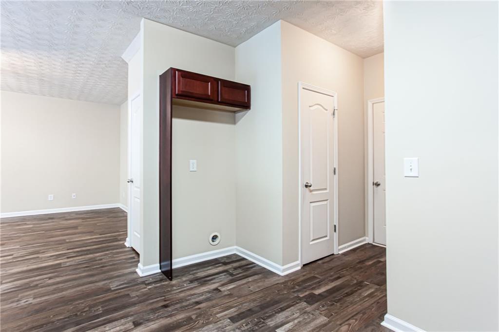 4628 McEver View Drive Sugar Hill, GA 30518 - Photo 12 of 30 a view of a hallway with wooden floor