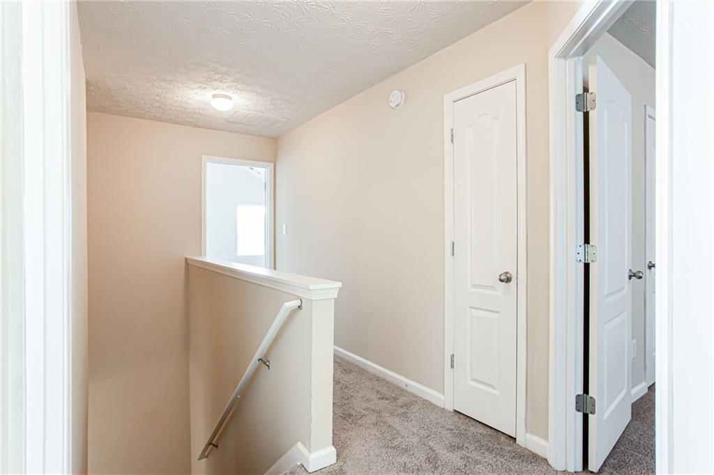 4628 McEver View Drive Sugar Hill, GA 30518 - Photo 15 of 30 a view of hallway with stairs