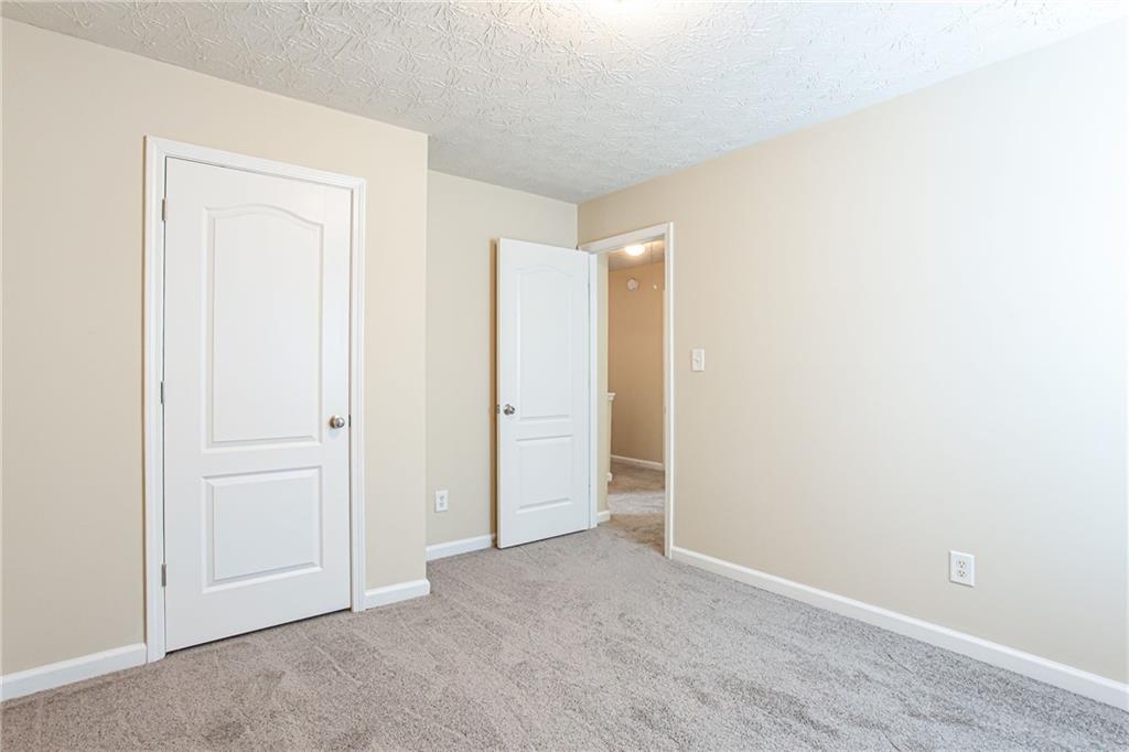 4628 McEver View Drive Sugar Hill, GA 30518 - Photo 22 of 30 an empty room with closet area