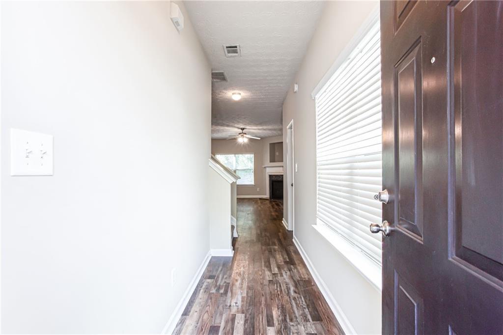 4628 McEver View Drive Sugar Hill, GA 30518 - Photo 3 of 30 a view of hallway with wooden floor