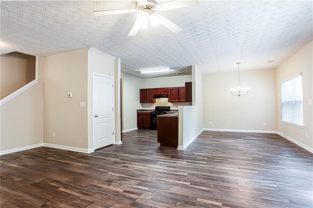 4628 McEver View Drive Sugar Hill, GA 30518 - Photo 7 of 30 a view of kitchen with livingroom and wooden floor
