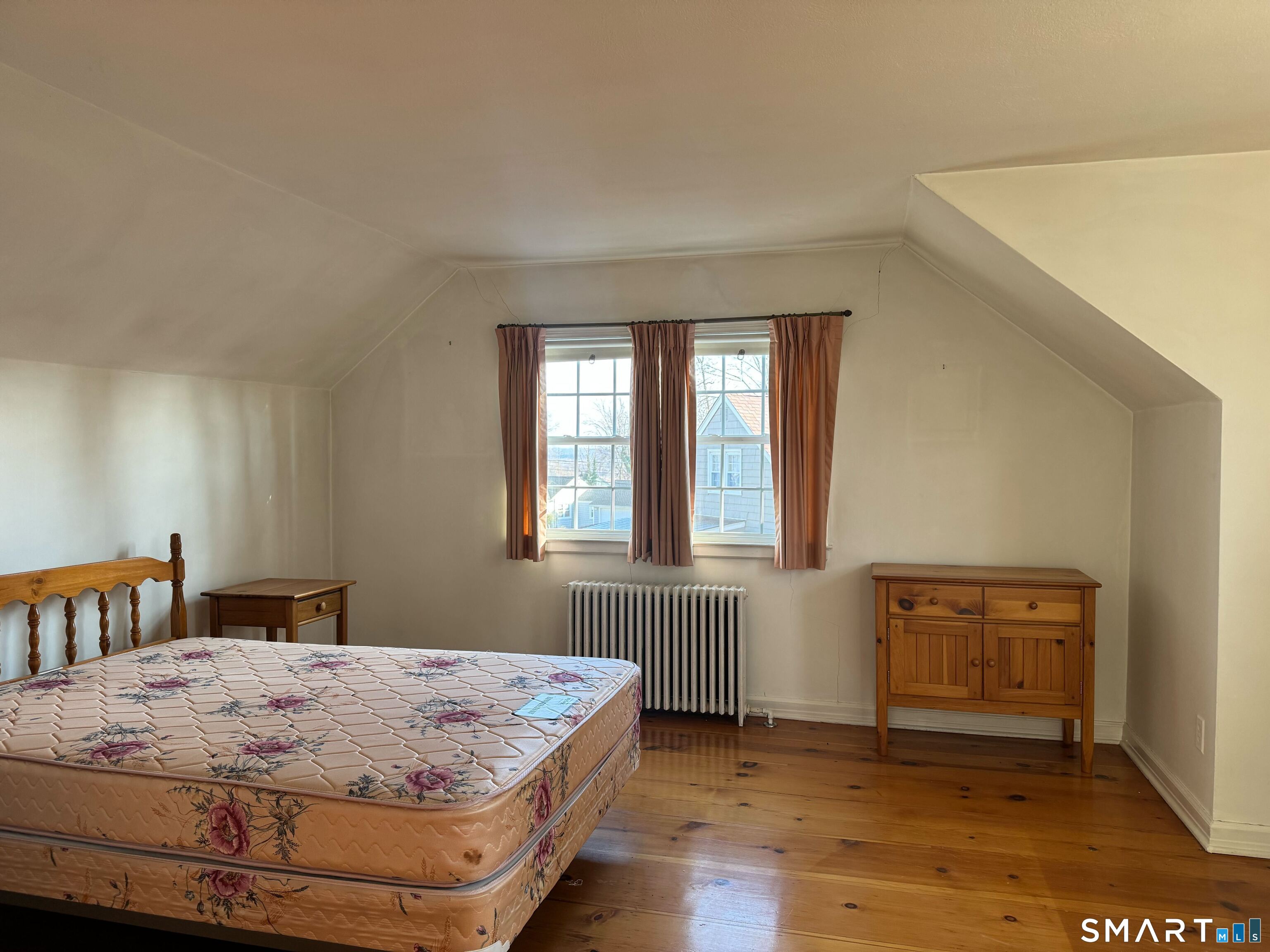 15 Townline Road Hamden, CT 06517 - Photo 12 of 16 a bedroom with a bed and wooden floor