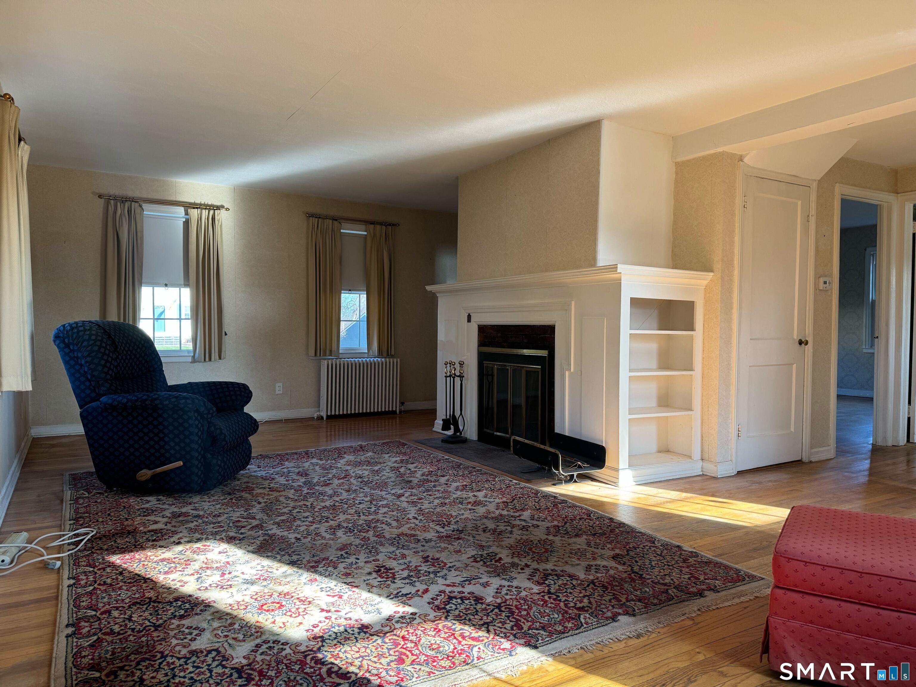 15 Townline Road Hamden, CT 06517 - Photo 3 of 16 a living room with furniture and a fireplace